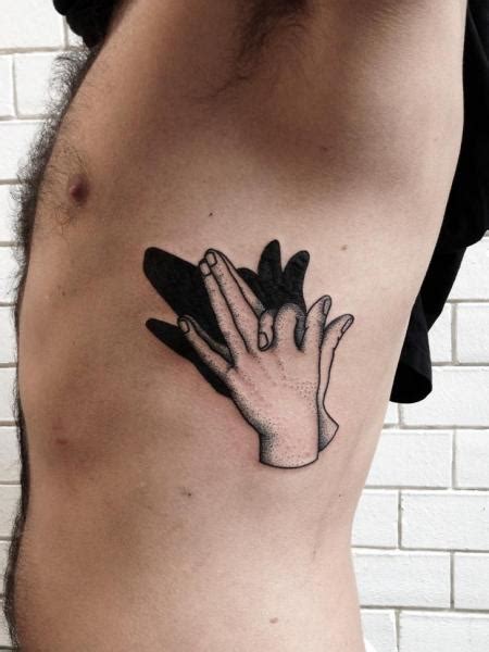 Shading a tattoo is as much about art as it is about technique. Side Hand Dotwork Shadow Tattoo by Philippe Fernandez
