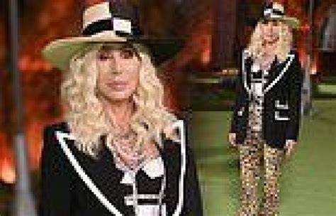 Cher Dons Curly Blonde Wig Leopard Print Trousers And A Straw Hat