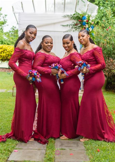 the bridesmaids are posing in their red gowns and matching with each other