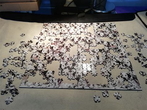Puzzles are cut in a press, and the downwards pressure slightly bends the layers in one direction. Update. World's Most Difficult: Dalmatians, Lamond ...