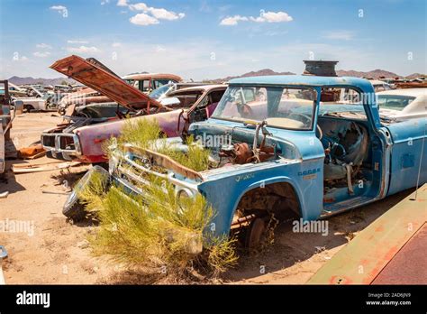 Rusty Old Cars And Trucks In A Junk Yard In The Desert In Phoenix