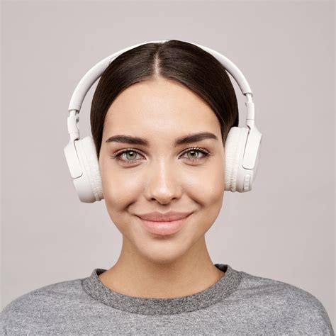 Portrait Photography Of Woman Wearing White Wireless Headphones · Free