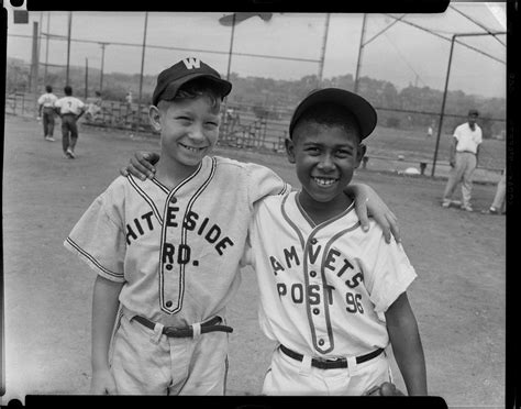 two little league baseball players one wearing whiteside road uniform and gary henderson in
