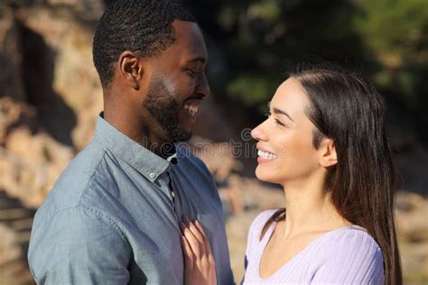 Interracial Couple In Love Looking Each Other Outdoors Stock Image Image Of Beauty Date