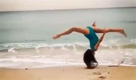 Video Of A Girl Performing A Flip On A Beach Then Kicking Her Own Face