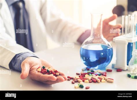 Colorful medicine pills and tablets in pharmaceutical lab. Concept of