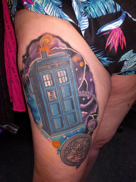 A Womans Thigh With A Doctor Who Tattoo On It And An Image Of The Tardish