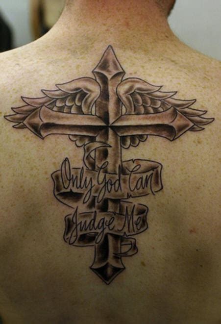 Cross tattoos often find themselves placed upon the calf as the tapered space is perfect for the shape of a standard cross. Winged cross memorial tattoo on upper back - Tattooimages.biz