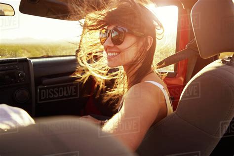 Woman Passenger On Road Trip In Convertible Car Stock Photo Dissolve