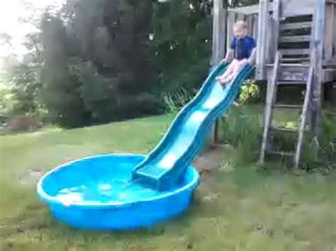 Giant inflatable slide for kids little tikes 2 in 1 wet n dry bounce children play center. Conner on slide into kiddie pool - YouTube