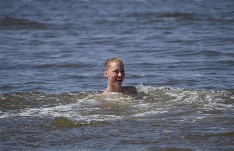 Blonde Girl Laughs And Enjoys Swimming In The Sea Water Girl On A