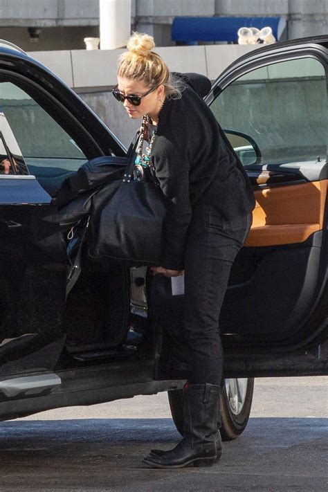 Amber is exceptionally dedicated to her fitness and takes on rigorous workouts when it comes to training for her movies. Amber Heard in a Black Outfit Was Spotted Out in Los ...