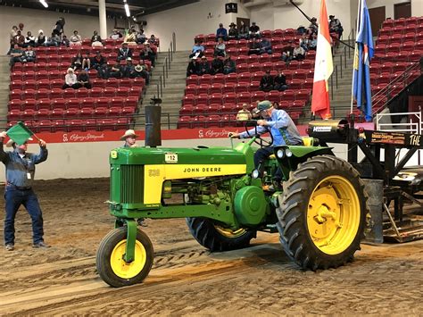 Vintage tractor enthusiasts pull and swap stories at Calgary Stampede