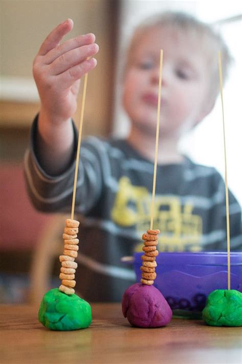 The rigid form of these straws makes this activity a great introduction to threading. Basic Cereal Threading Activity for Toddlers | Activities ...