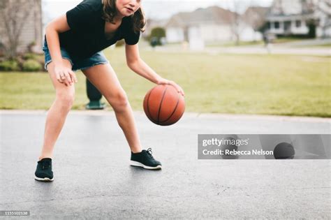 Adolescent Girl Dribbling Basketball High Res Stock Photo Getty Images