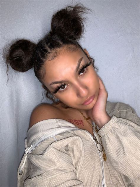 Loose bun with a crown braid. Braided Space buns with edges and double nose ring 😍 ...