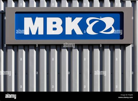 Mbk Logo On A Wall Mbk A Subsidiary Of Yamaha Motor Company Is A