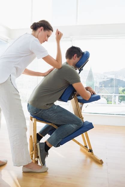 premium photo professional female therapist giving massage to man