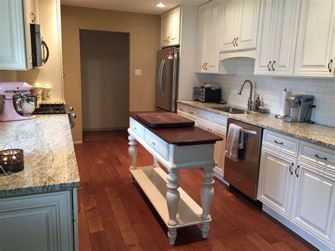 It's white color provide neat and clean look. My kitchen Antique white cabinets Ivory ceramic beveled ...