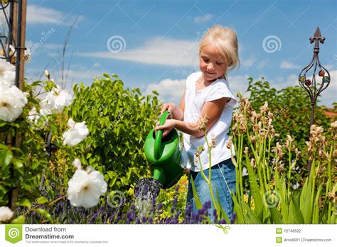 Little Girl Watering Flowers Stock Photography Image 12746522