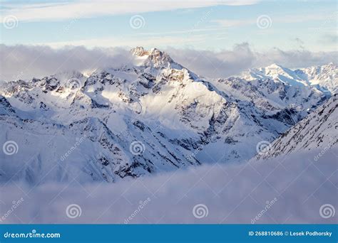 Snowy Mountains In The Clouds Solden In The Austrian Alps Stock Photo