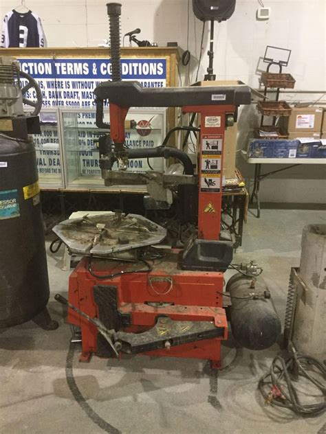 Changing car wheel or tire. Tire Change machine