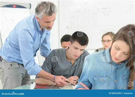 Teacher Explaining Students In Classroom Stock Image Image Of Teache