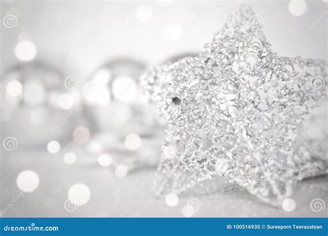 Star And Shiny Silver Ornaments On Bright Abstract Background Bokeh