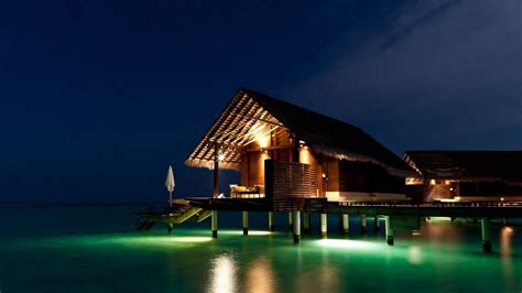 download wallpaper 2560x1440 maldives tropical bungalows night widescreen 16 9 hd background