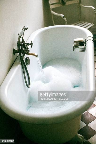 water filling tub photos and premium high res pictures getty images