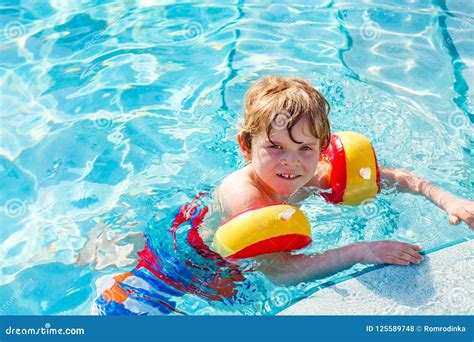 Happy Little Kid Boy Having Fun In An Swimming Pool Active Happy Child