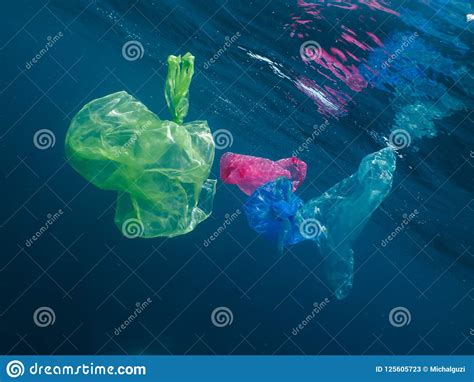Colorful Plastic Bags Floating In The Ocean Stock Image Image Of