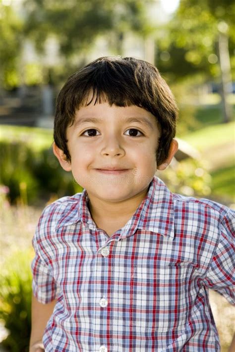 Handsome Young Hispanic Boy In The Park Stock Photo Image Of Nature