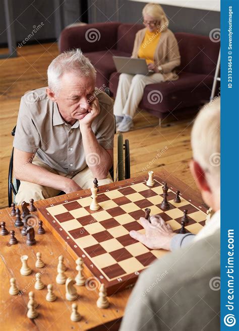 People Playing Chess In Retirement Home Stock Image Image Of Senior