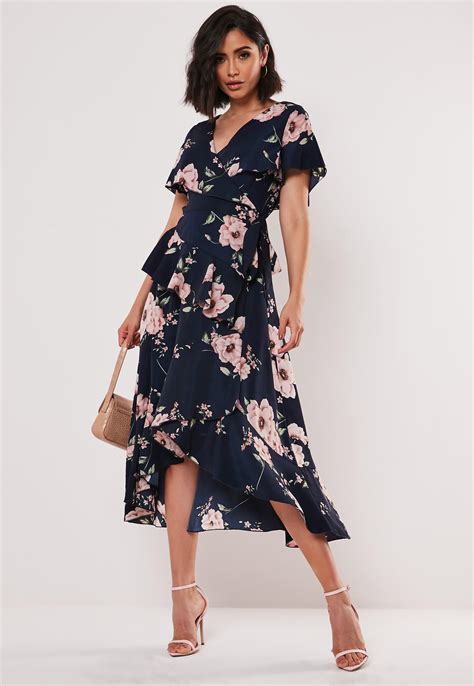 All orders are custom made and most ship worldwide within 24 hours. Missguided Synthetic Navy Floral Ruffle Wrap Midi Dress in ...