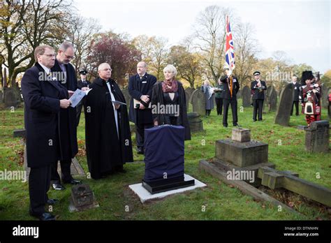 Geraldine Winner waits to unveil the new gravestone marking the grave