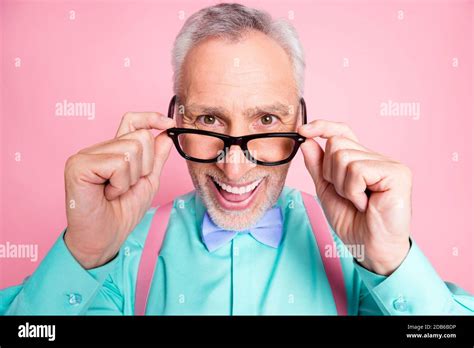 Closeup Headshot Photo Of Happy Funny Old Man Touching Eyeglasses