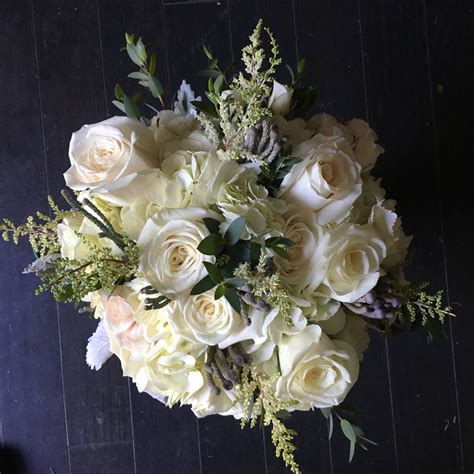 Bouquets let you add a beautiful display or centerpiece to your wedding tables. all white and cream bouquet playa blanca roses, brunea ...