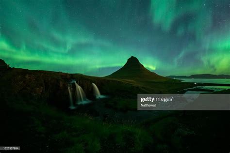 Northern Lights Over Kirkjufellsfoss And Kirkjufell Mountain Iceland