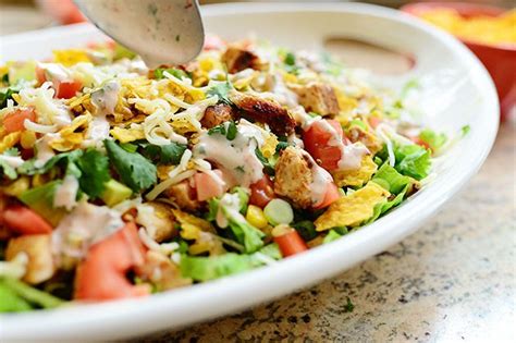 Toss the cooked veggies into a bowl and add the bacon pieces, lettuce, cilantro, grated cheddar cheese. Chicken Taco Salad by Ree Drummond / The Pioneer Woman. We ...