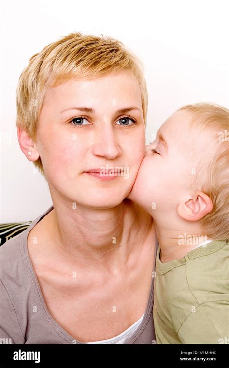 Babe Kissing Mother S Cheek Stock Photo Alamy