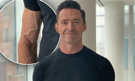 Hugh Jackman Flaunts His Very Vascular Arms In A Tight Black T Shirt As