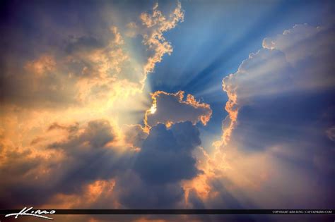 Glorious Rays Of Light Beams Burst Through Clouds In The Sky With