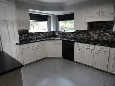 We love it when a fabulous kitchen before and after was accomplished with just paint! Kitchen, glass mosaic tile, floor tile, paint, before and ...