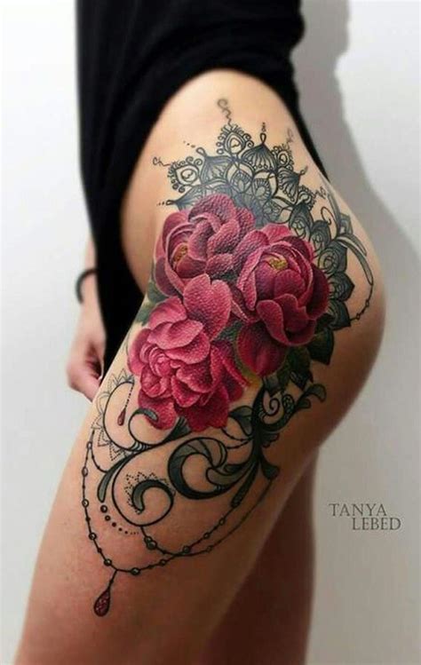 A crow with flowers is spicing up her tattoo. Watercolor Rose Thigh Tattoo Ideas at MyBodiArt.com ...