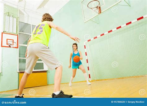 Girl Dribbling The Ball During Basketball Match Stock Photo Image Of