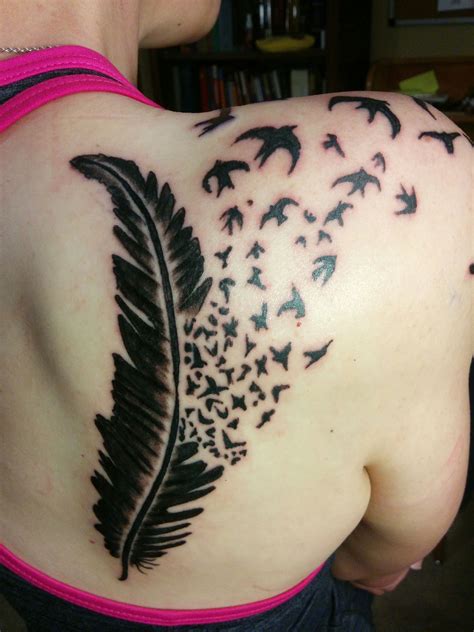 Feather dissolving into birds by John at Happy Dragon in Abilene TX