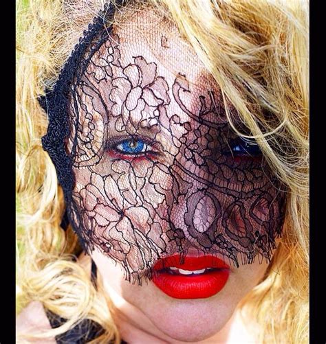 girl wearing black lace veil over face and red lipstick bar outfits supermodels veil over face