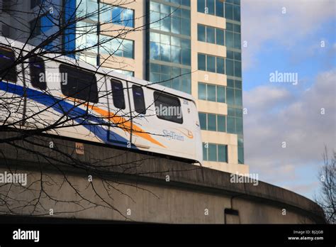 Skytrain Light Rapid Transit With Hi Rises Vancouver British Columbia