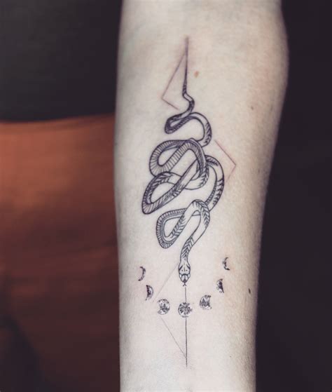 Depending on your cultural reference point, snake tattoos can symbolize a variety of characteristics and meanings. #snake #snaketattoo #moon #moontattoo #linework #lineart # ...